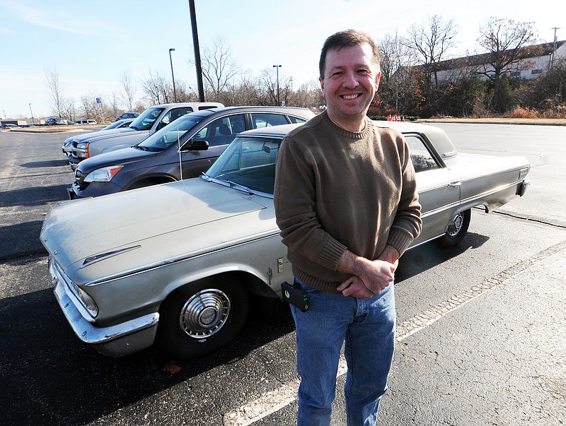 Mark Wilson/News TribuneMODOT employee Jason Shafer and his 1963 Ford Galaxy.