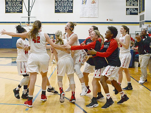 The Jefferson City Lady Jays celebrate on the court Saturday, Dec. 29, 2018, after they defeated St. Joseph Benton to win the State Farm Holiday Hoops Invitational at Rackers Fieldhouse.