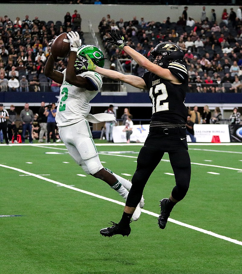 Cuero Gobblers defensive back Deondrae Lang intercepts a pass intended for Pleasant Grove Hawks wide receiver Brett Walker on Dec. 21, 2018, at the AT&T Stadium for the Conference 4A Division 2 Football State Championship in Dallas, Texas. The final score of the game was 28-40.