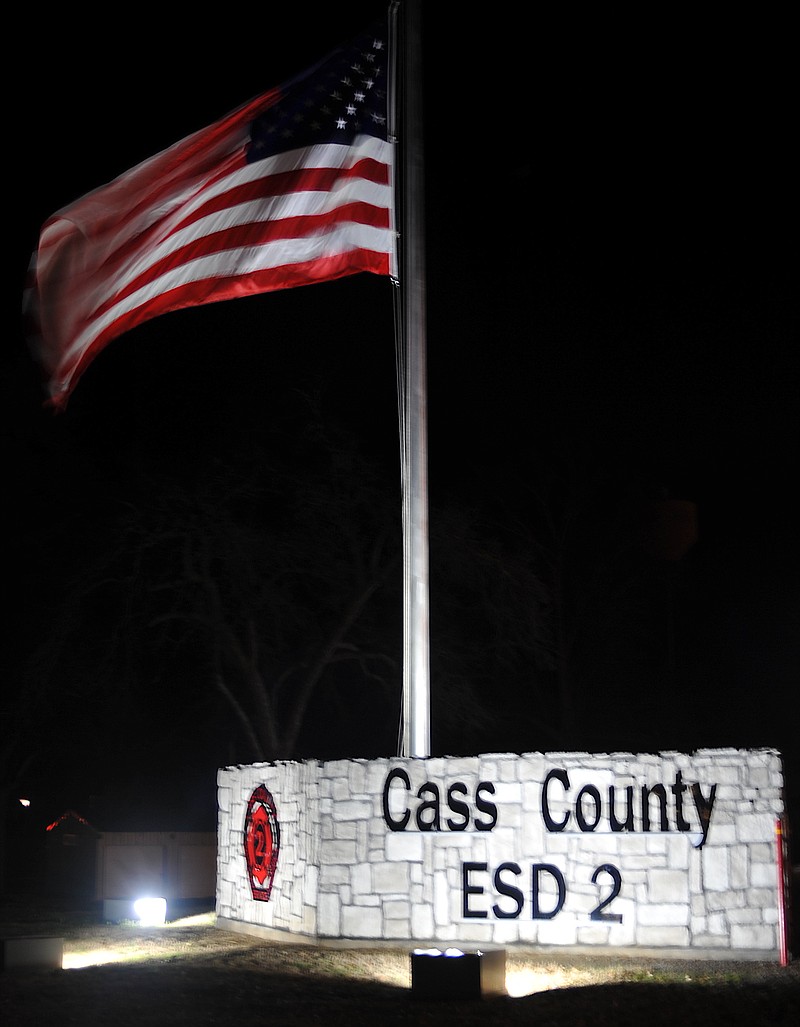 The Cass County Emergency Services District 2's new flag is seen at its central station in Queen City, Texas. This recognition display is an accomplishment of district youth and adult volunteers.