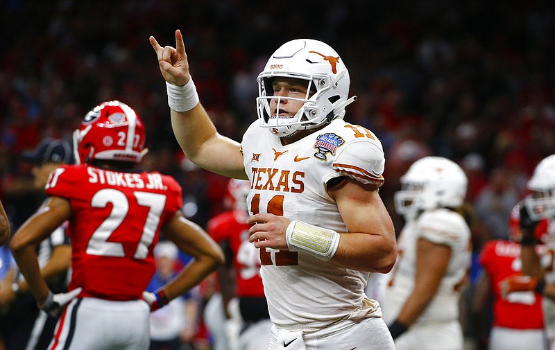 Texas quarterback Sam Ehlinger celebrates his second touchdown carry in the first half of the Sugar Bowl NCAA college football game against Georgia in New Orleans, Tuesday, Jan. 1, 2019. 