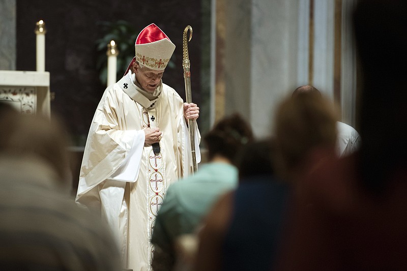 FILE - In this Aug. 15, 2018 file photo, Cardinal Donald Wuerl, Archbishop of Washington, conducts Mass at St. Mathews Cathedral in Washington. Over the past four months, Roman Catholic dioceses across the U.S. have released the names of more than 1,000 priests and others accused of sexually abusing children in an unprecedented public reckoning spurred at least in part by a shocking grand jury investigation in Pennsylvania, an Associated Press review has found. (AP Photo/Kevin Wolf, File)