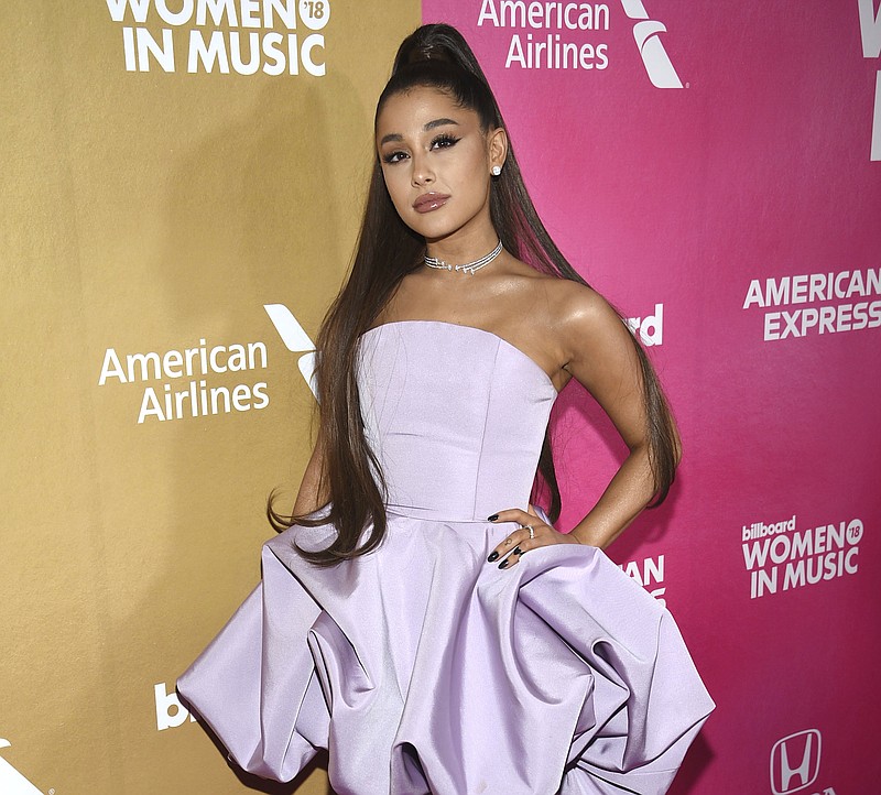 FILE - In this Thursday, Dec. 6, 2018 file photo, Ariana Grande attends the 13th annual Billboard Women in Music event at Pier 36, in New York. The organizers of the 2019 Coachella Valley Music and Arts Festival have announced the top acts scheduled to appear at the multiday event in April. Goldenvoice, the promoter of the event, said Wednesday night, Jan. 2, 2019, that the big names scheduled to perform at the two-weekend event from April 12 to April 14 and from April 19 to April 21 include Grande, Childish Gambino, Tame Impala and Janelle Monae. (Photo by Evan Agostini/Invision/AP, File)