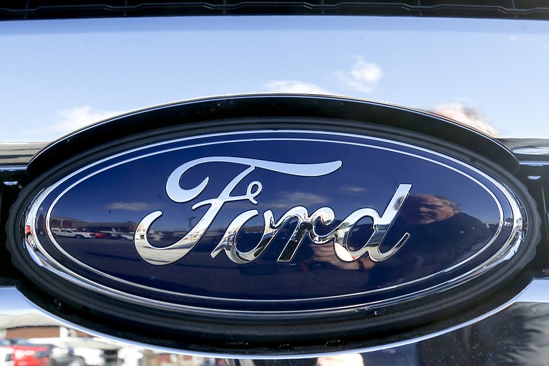 FILE - This Nov. 19, 2015 file photo shows the blue Ford oval badge in the grill of a pickup truck on the sales lot at Butler County Ford in Butler, Pa.  On Friday, Jan. 4, 2019, Ford is recalling more than 953,000 vehicles worldwide to replace Takata passenger air bag inflators that can explode and hurl shrapnel. The move includes 782,000 vehicles in the U.S. and is part of the largest series of recalls in U.S. history.(AP Photo/Keith Srakocic, File)