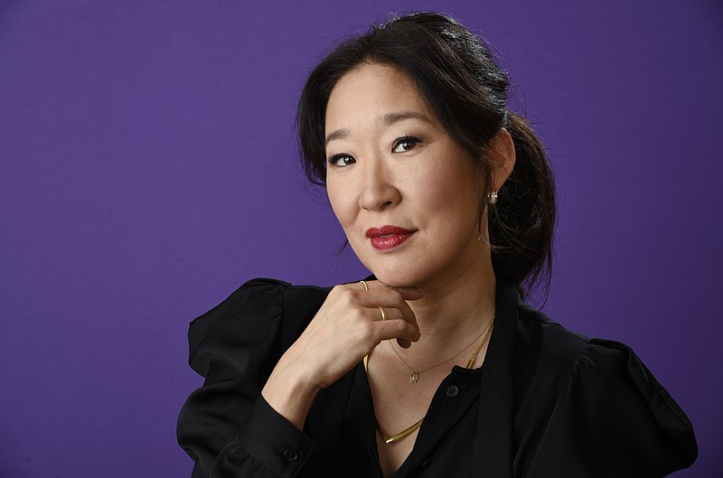 FILE - In this Friday, Jan. 12, 2018 file photo, Sandra Oh poses for a portrait in Pasadena, Calif. This year’s Golden Globe Awards is set to feel like a major evolution from four years ago, when comedian Margaret Cho was the only Asian on stage the entire evening. The awards show telecast Sunday, Jan. 6, 2019, on NBC will have a decidedly different feel with co-host Oh as the first ever Asian emcee and rom-com “Crazy Rich Asians” up for two nominations, including best comedy or musical. (Photo by Chris Pizzello/Invision/AP, File)