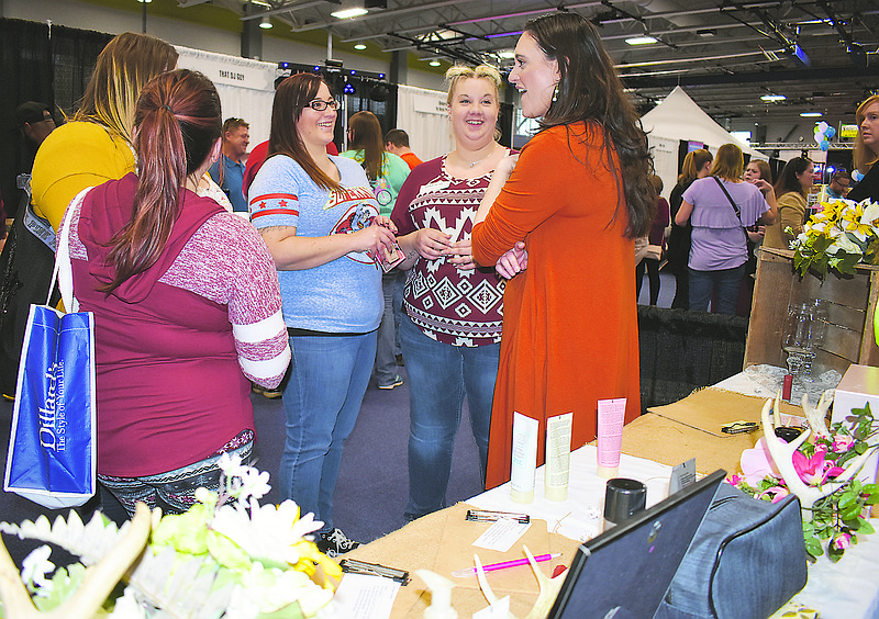 Mary Kay consultant Brittnie Brauner, at right, chats with, from left, Brianna Wolfe, Ashley Vaught, Brooke Boillot and Taylor Strope at Sunday's 32nd annual Bridal Spectacular at The Linc.