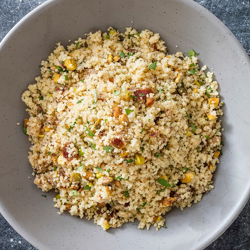 This undated photo provided by America's Test Kitchen in December 2018 shows Simple Couscous with Dates and Pistachios in Brookline, Mass. This recipe appears in the cookbook "Complete Mediterranean." (Daniel J. van Ackere/America's Test Kitchen via AP)