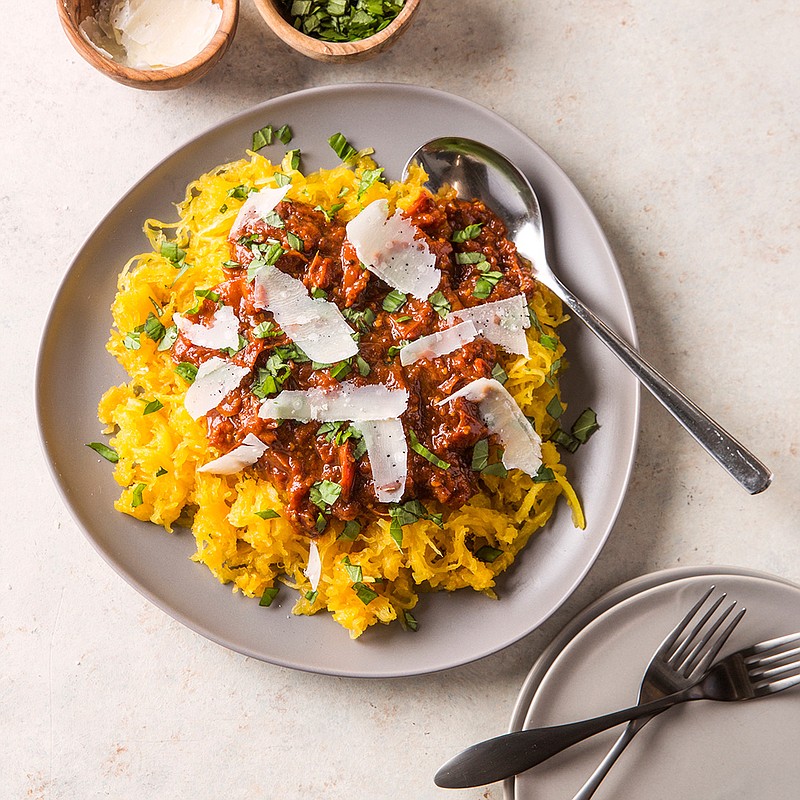 This undated photo provided by America's Test Kitchen in December 2018 shows Spaghetti Squash with Tomato Sauce in Brookline, Mass. This recipe appears in the cookbook "Multicooker Perfection." (Joe Keller/America's Test Kitchen via AP)