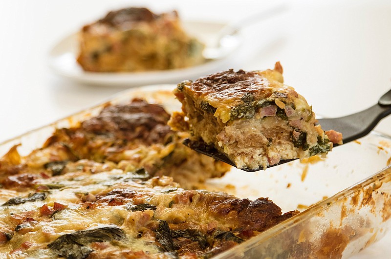 This breakfast casserole is made with eggs, whole milk, mini croissants, diced ham, sweet onions, baby spinach, a touch of dijon mustard and fontina cheese. (Melanie Maxwell/Detroit Free Press/TNS)