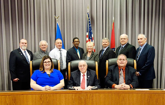 Courtney Crowson, Fulton city clerk (front, left), Mayor LeRoy Benton and City Administrator Bill Johnson are flanked by members of the Fulton City Council.