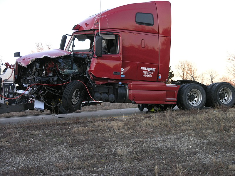 <p>Democrat photo/Danisha Hogue</p><p>A 2012 Volvo VNL is towed away after rear ending a California man driving a backhoe.</p>