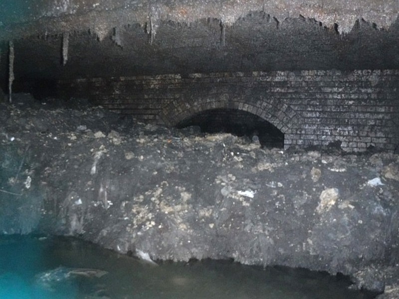 In this photo released Tuesday Jan. 8, 2019, by Britain's South West Water company, showing part of a "fatberg", a mass of hardened fat, oil and baby wipes, measuring some 64 meters (210 feet) long, in the town of Sidmouth, England.  The fatberg is blocking a sewer in the southwestern English town, and will take a sewer team around eight weeks to dissect and dispose of the obstruction. (South West Water via AP)