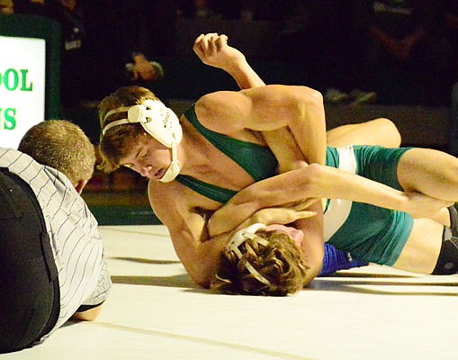 Dalton Bridges of Blair Oaks has Lucas Laux of Fatima on his back during their 126-pound match Tuesday night in Wardsville. Laux rebounded to win the match by fall in the third period.