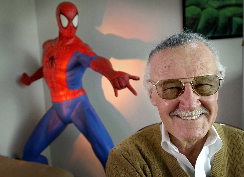 This April 16, 2002 file photo shows Stan Lee, creator of comic-book franchises such as "Spider-Man," "The Incredible Hulk" and "X-Men," posing near a Spider-Man figure in his Santa Monica, Calif., office. Friends, fans and family of Stan Lee will gather in Hollywood on Jan. 30 for a memorial honoring the life and work of late Marvel Comics mogul. (AP Photo/Reed Saxon, File)