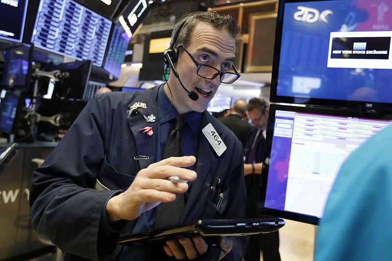 Trader Gregory Rowe works on the floor of the New York Stock Exchange, Wednesday, Jan. 9, 2019. Stocks are opening higher on Wall Street, putting the market on track for a fourth gain in a row. (AP Photo/Richard Drew)