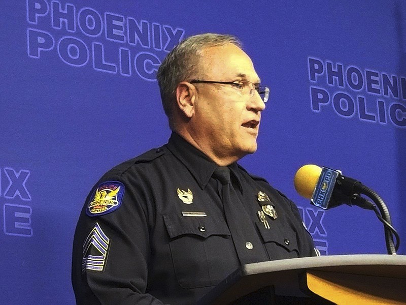 Phoenix Police spokesman Tommy Thompson speaks at a news conference, Wednesday, Jan. 9, 2019, in Phoenix, about the investigation of a woman at a long-term care facility who gave birth. The Phoenix woman, who is in a vegetative state and was sexually assaulted at the facility and had a baby, is recovering at a hospital along with her child, authorities said. (AP Photo/Terry Tang)