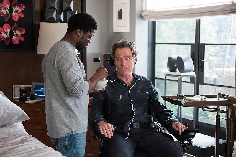 This image released by STXfilms shows Kevin Hart, left, and Bryan Cranston in a scene from "The Upside." (David Lee/STXfilms via AP)