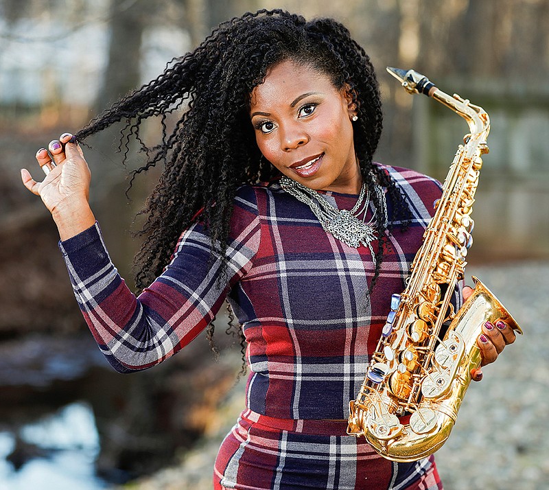 This Jan. 6, 2019 photo shows saxophonist Tia Fuller posing in Piscataway, N.J. Fuller, who teaches at Berklee College of Music and famously toured with Beyonce as part of her all-female band, is nominated for her first Grammy in the best instrumental jazz album category. (Photo by Brian Ach/Invision/AP)