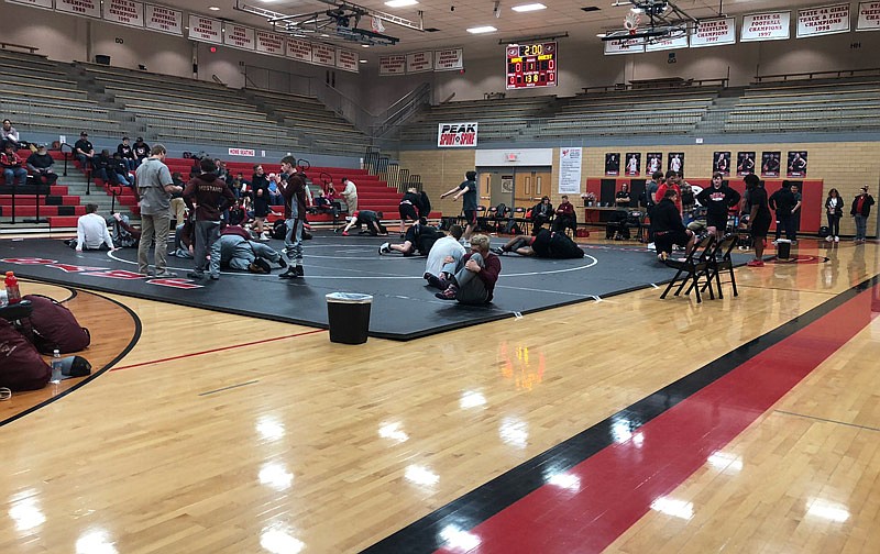 Wrestlers warm up at Fleming Fieldhouse Wednesday, Jan. 9, 2019, as the Jays and Eldon get set to start the double dual with Battle being the third team.
