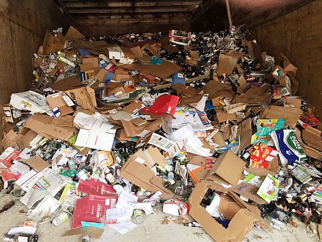 A Ripple Glass bunker is filled with cardboard boxes, plastic bags, newspapers and other non-glass items. Jefferson City officials are urging residents to not toss items other than glass in the Ripple Glass recycling containers after the company noticed an increase in contamination.