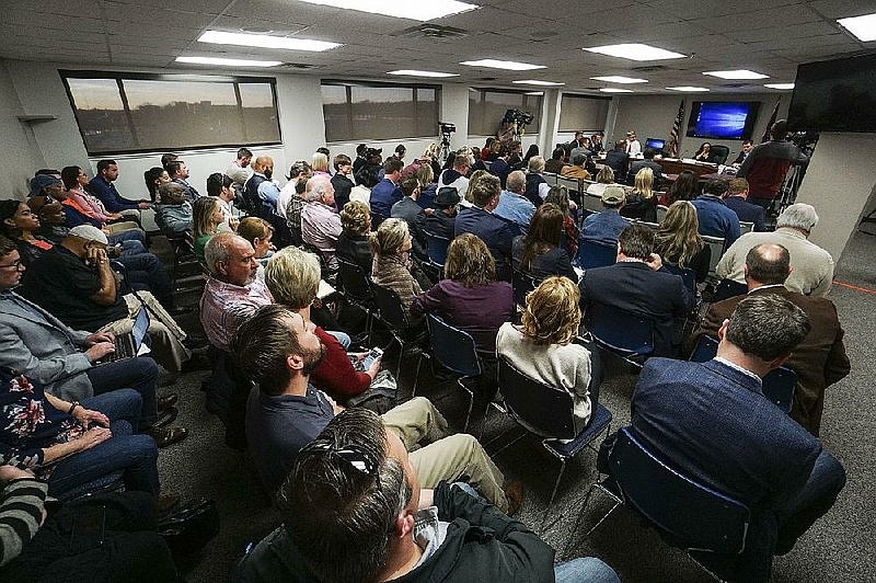 People fill the room Wednesday as the Arkansas Medical Marijuana Commission considers a consulting firm's scores of applications for medical marijuana dispensaries. (Mitchell PE Masilun)