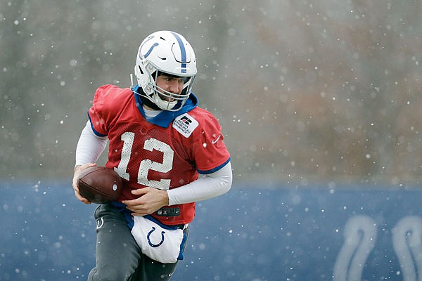 Colts quarterback Andrew Luck runs a drill during practice Wednesday at the team's facility in Indianapolis.
