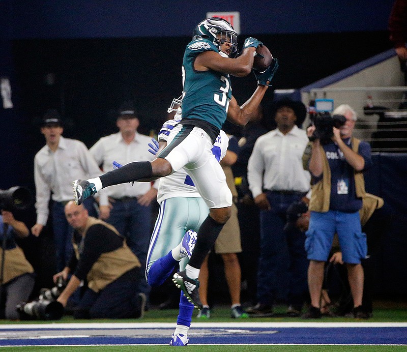  In this Dec. 9, 2018, file photo, Philadelphia Eagles cornerback Rasul Douglas (32) intercepts a pass by Dallas Cowboys quarterback Dak Prescott during the first half of an NFL football game, in Arlington, Texas. When injuries ravaged the secondary, the Eagles turned to inexperienced guys and castoffs. The no-names are making themselves known. (AP Photo/Michael Ainsworth, File)