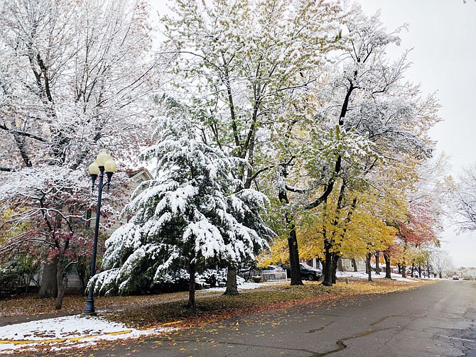 Court Street was caught between seasons following an unusual early snowfall in November. More snow is on its way, meteorologists predict.