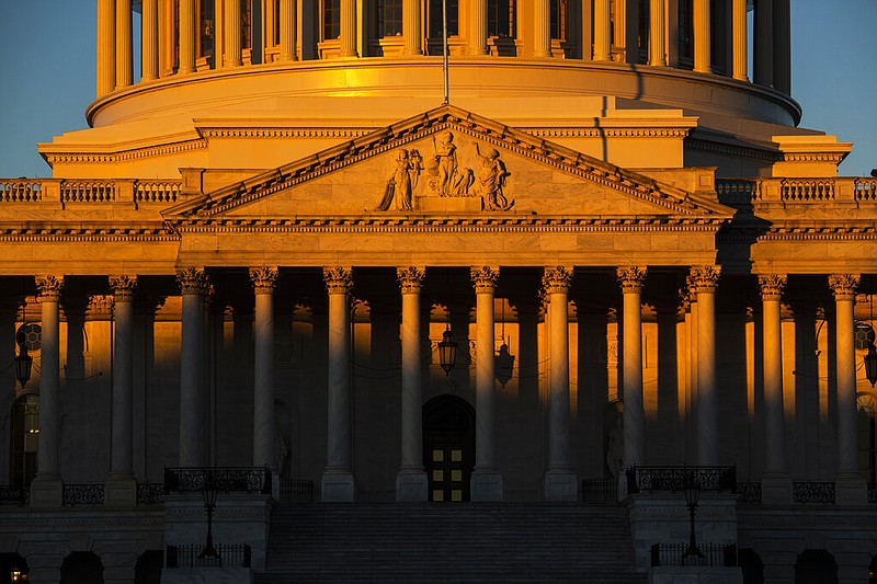 The Capitol is seen at dawn on the 21st day of a partial government shutdown as an impasse continues between President Donald Trump and Democrats over funding his promised wall on the U.S.-Mexico border, in Washington, Friday, Jan. 11, 2019.