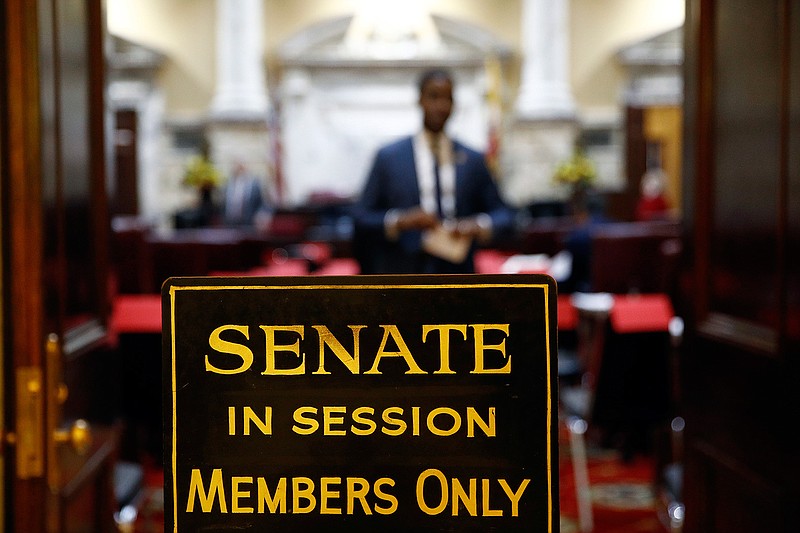 In this Wednesday, Jan. 9, 2019 file photo, a sign stands outside an entrance to the Maryland State Senate chamber in Annapolis, Md., on the first day of the state's 2019 legislative session. The U.S. Supreme Court has scheduled arguments in March 2019 on an appeal of a ruling that western Maryland's 6th Congressional District is an unconstitutional partisan gerrymander that diluted the voting power of Republicans. (AP Photo/Patrick Semansky)