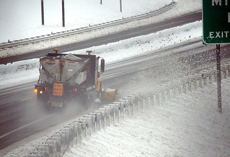 
A snow plow removes snow from the street Saturday, January 12, 2019, along Highway 54 in Jefferson City.