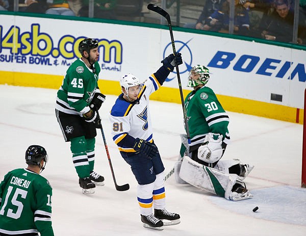 Blues right wing Vladimir Tarasenko celebrates his power-play goal in front of Stars defenseman Roman Polak (45) and goaltender Ben Bishop (30) during the third period of Saturday night's game in Dallas.