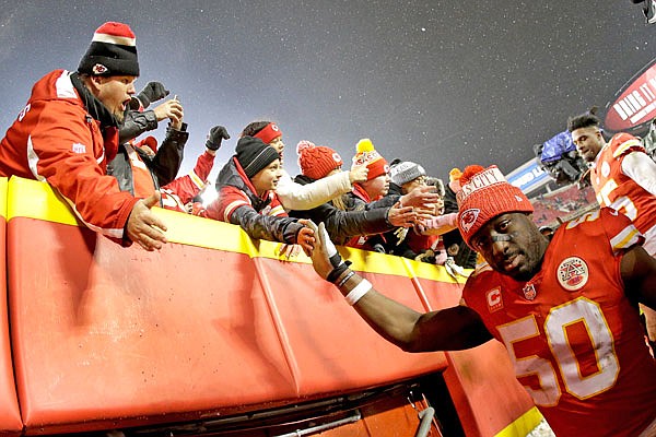 Chiefs outside linebacker Justin Houston celebrates with fans after Saturday's AFC divisional playoff game against the Colts at Arrowhead Stadium.