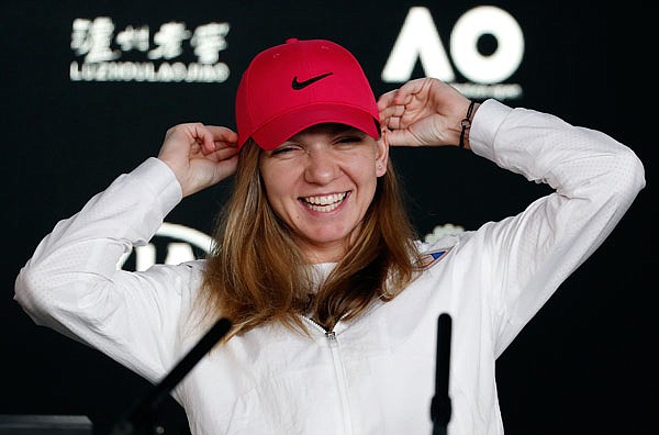 Simona Halep smiles during a press conference Saturday prior to the start of the Australian Open in Melbourne, Australia.