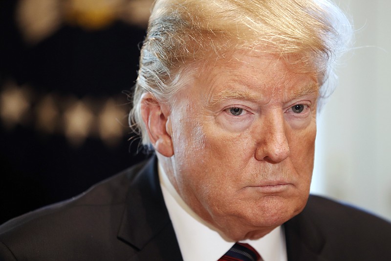 President Donald Trump attends a roundtable discussion on border security with local leaders, Friday Jan. 11, 2019, in the Cabinet Room of the White House in Washington. (AP Photo/Jacquelyn Martin)