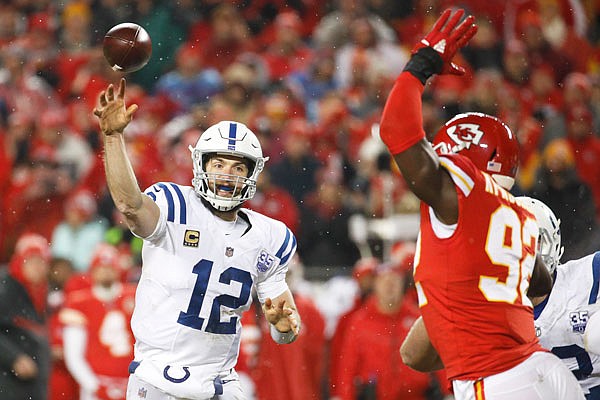 Colts quarterback Andrew Luck throws a pass as Chiefs linebacker Tanoh Kpassagnon defends during the second half of Saturday's AFC divisional playoff game at Arrowhead Stadium.