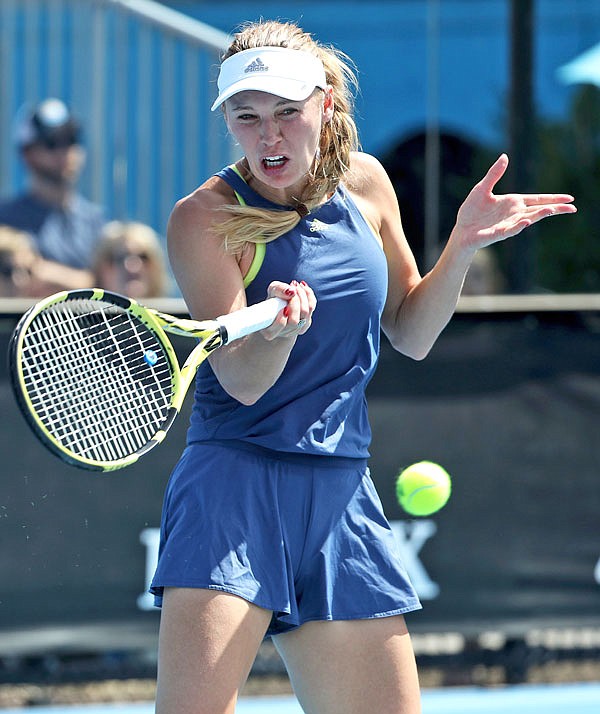 Caroline Wozniacki makes a forehand return during Saturday's practice session ahead of the Australian Open in Melbourne, Australia.