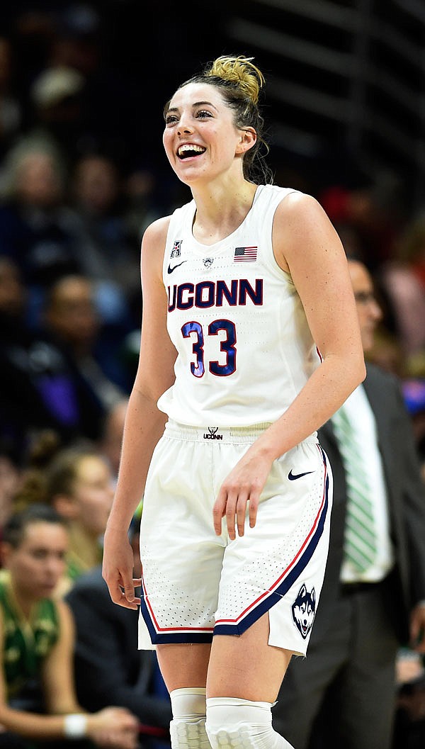 Connecticut's Katie Lou Samuelson smiles shortly after surpassing her 2,000th career point in the second half of Sunday's game against South Florida in Storrs, Conn.