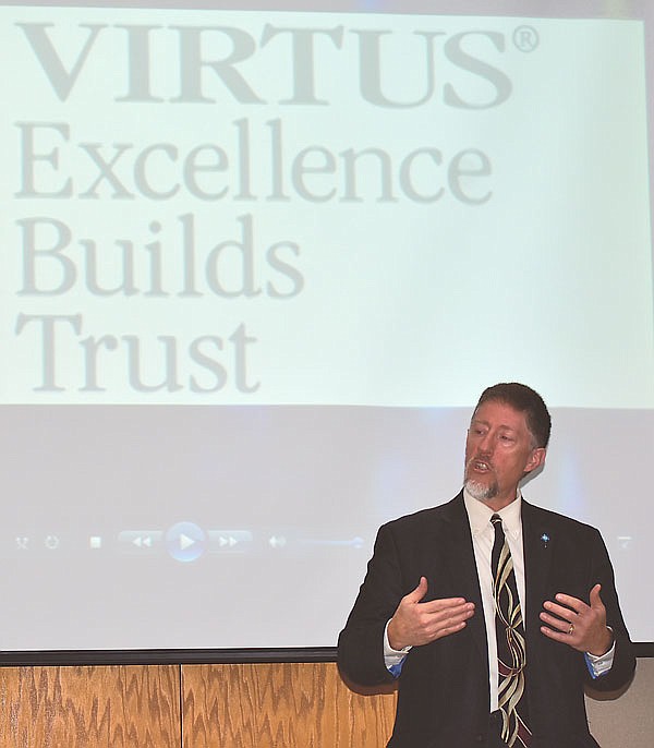 Michael Berendzen, the safe environment coordinator for the Jefferson City Diocese, gives a VIRTUS training presentation to 14 people on Sunday at the diocese' Chancery offices.