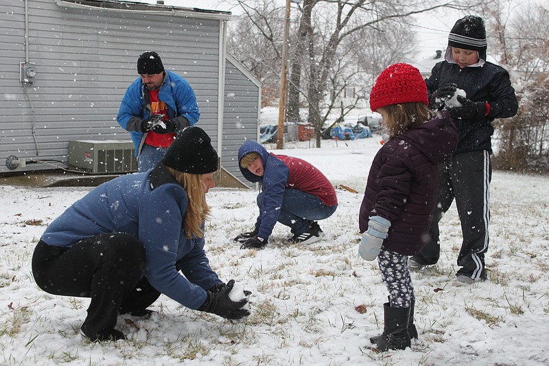 A good time was had by all Jan. 11, 2019, for the Wemerson children. Snow hit California in the mid-afternoon hours on that Friday, which made for the first time Isabella, Lucas and Max Wemerson have ever seen or touched snow. Sara Blecke Ferreria, left, shows Isabella, 3, how to make a snowball. Behind them, Max crouches to follow suite while Lucas looks on.