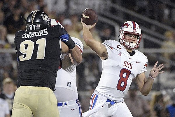 SMU quarterback Ben Hicks (8) throws a pass in front of Central Florida defensive lineman Joey Connors (91) during the first half of an NCAA college football game Saturday, Oct. 6, 2018, in Orlando, Fla. 