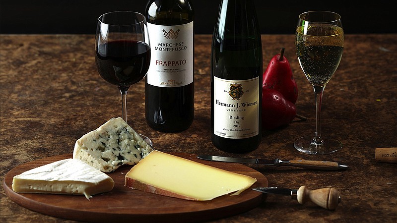 Frappato and riesling are two grapes that pair well with a variety of cheeses. From Sicily, try Marchese Montefusco Frappato, left. From the Finger Lakes, try Dr. Konstantin Frank Riesling. (E. Jason Wambsgans/Chicago Tribune/TNS) 