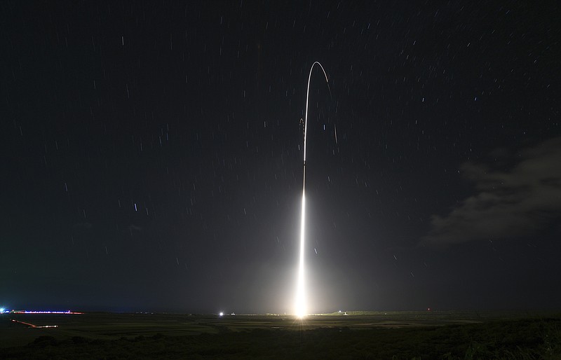 FILE - This Dec. 10, 2018, file photo, provided by the U.S. Missile Defense Agency (MDA),shows the launch of the U.S. military's land-based Aegis missile defense testing system, that later intercepted an intermediate range ballistic missile, from the Pacific Missile Range Facility on the island of Kauai in Hawaii. The Trump administration is considering ways to expand U.S. homeland and overseas defenses against a potential missile attack, possibly adding a layer of satellites in space to detect and track hostile targets. (Mark Wright/Missile Defense Agency via AP)