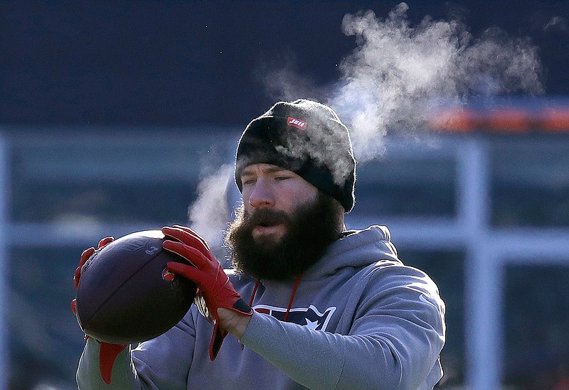 New England Patriots wide receiver Julian Edelman warms up before an NFL divisional playoff football game against the Los Angeles Chargers, Sunday, Jan. 13, 2019, in Foxborough, Mass. (AP Photo/Charles Krupa)
