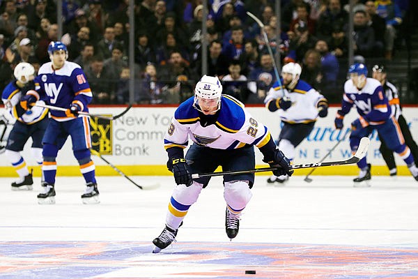 Blues defenseman Vince Dunn goes after the puck during the second period of Tuesday night's game against the Islanders in New York.