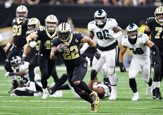 Saints running back Mark Ingram breaks away from the line of scrimmage during Sunday's game against the Eagles in New Orleans.