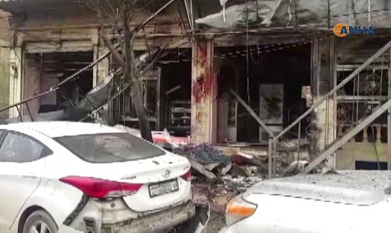 This frame grab from video provided by Hawar News, ANHA, the news agency for the semi-autonomous Kurdish areas in Syria, shows a damaged restaurant where an explosion occurred, in Manbij, Syria, Wednesday, Jan. 16, 2019. The Britain-based Syrian Observatory for Human Rights, a Syrian war monitoring group, and a local town council said Wednesday that the explosion took place near a patrol of the U.S.-led coalition and that there are casualties.