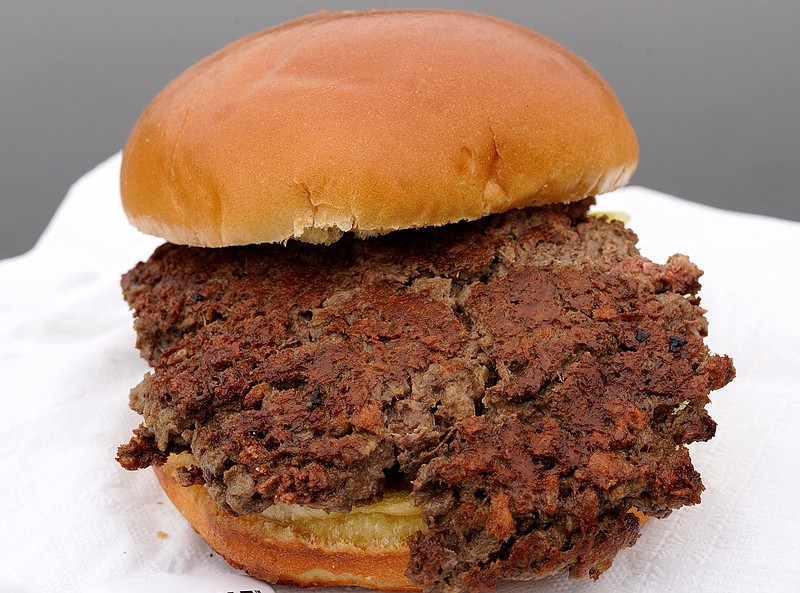 This Friday, Jan. 11, 2019 photo shows a plant-based burger made from wheat protein, coconut oil, potato protein and other ingredients in Bellevue, Neb. Released on Wednesday, Jan. 16, 2019, a report from a panel of nutrition, agriculture and environmental experts recommends a plant-based diet, based on previously published studies that have linked red meat to increased risk of health problems. (AP Photo/Nati Harnik)