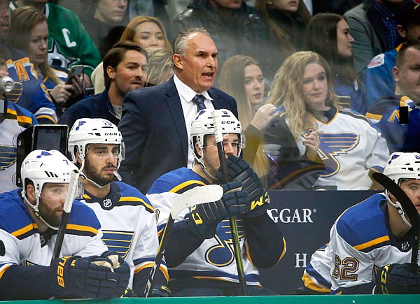 Blues interim head coach Craig Berube watches his team play the Stars during the first period of last Saturday's game in Dallas. The interim coach has turned things around since replacing Mike Yeo in November and instilled a consistency in the Blues' game.