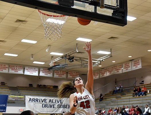 Micah Linthacum of Jefferson City goes up for a shot during a game this season against Miller Career Academy in the Capital City Shootout at Fleming Fieldhouse.